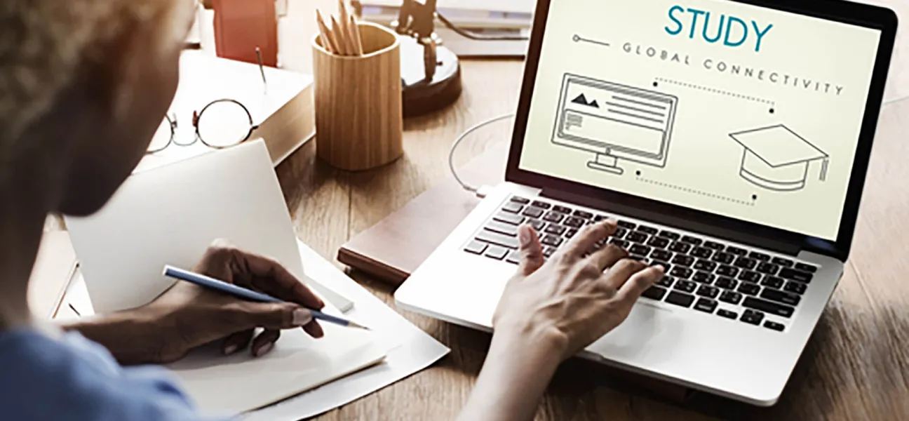 Student taking online continuing education classes on laptop.