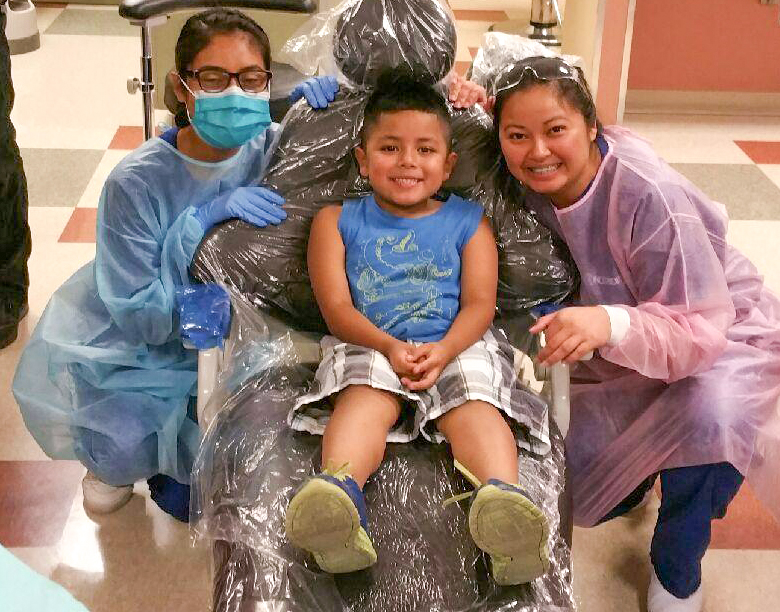 smiling kid at the dentist office