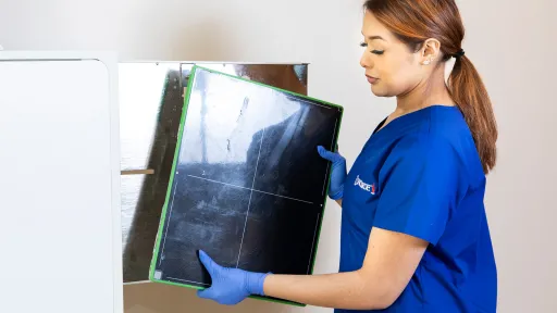 Technology skills being demonstrated by radiology tech holding x-ray film