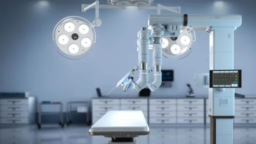 A view of a modern surgical operating room featuring a robotic surgical system over an operating table and illuminated by large ceiling-mounted surgical lights.