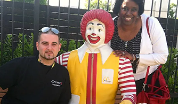 Two students from Concorde's Dallas campus pose with Ronald McDonald.