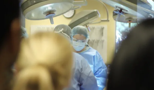 Students watch a surgery.