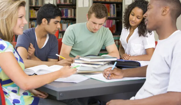 College students studying together in a library