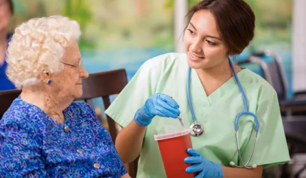 nurse disposing syringes