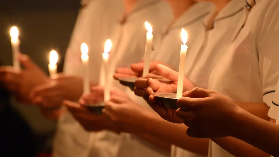 Nursing Pinning and Capping ceremony where participants are holding candles
